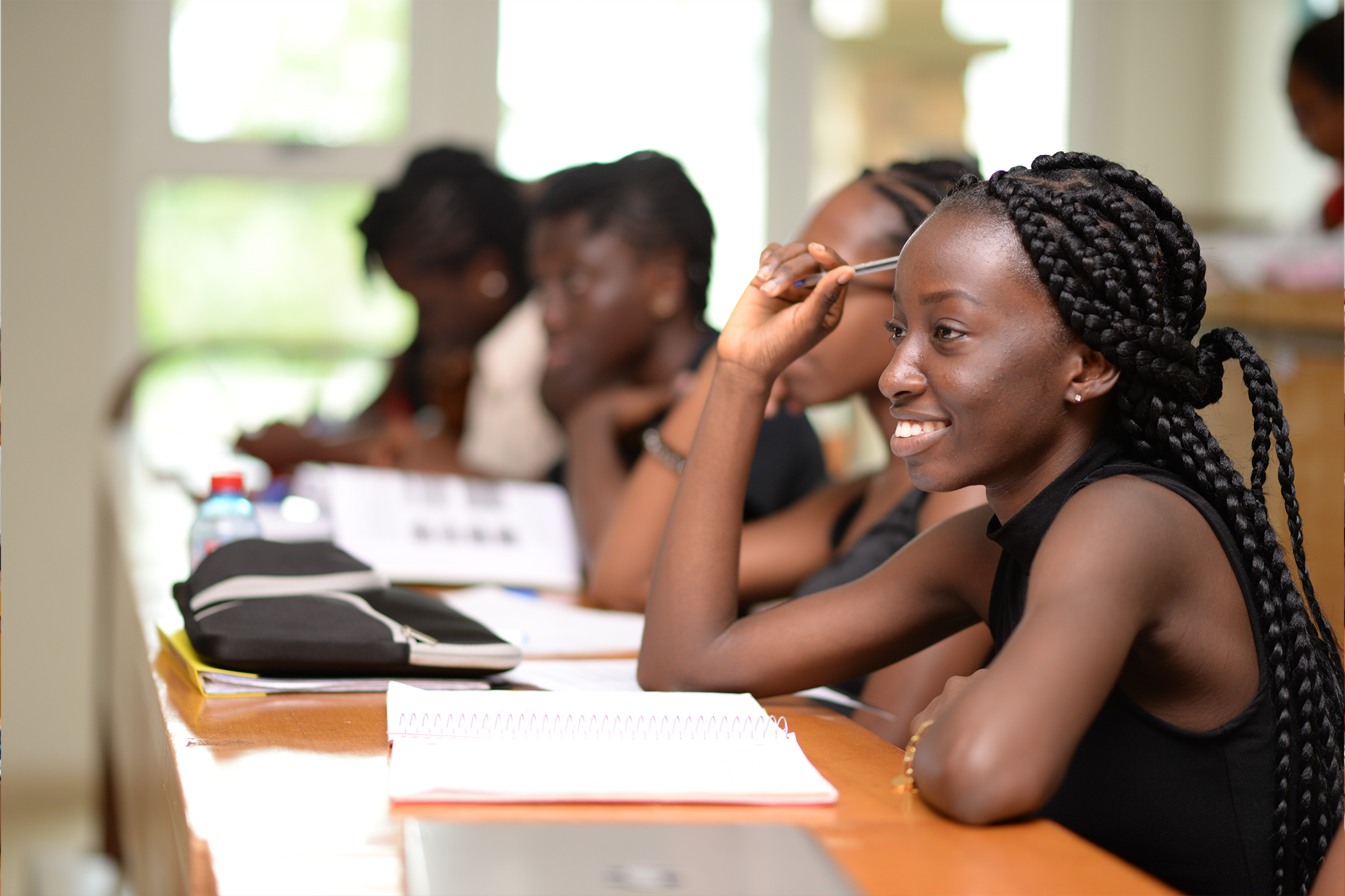 Ashesi student in a classroom asking a question